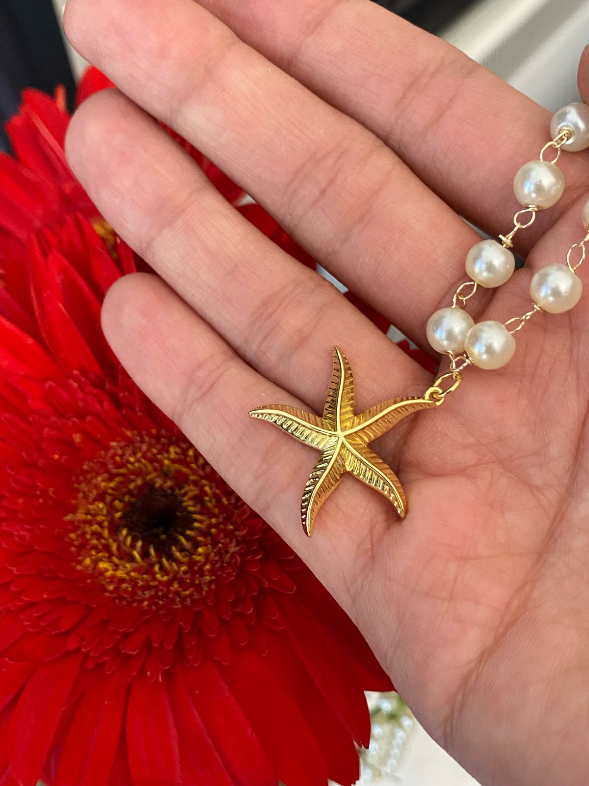 ESTRELLA DE MAR CON PERLAS