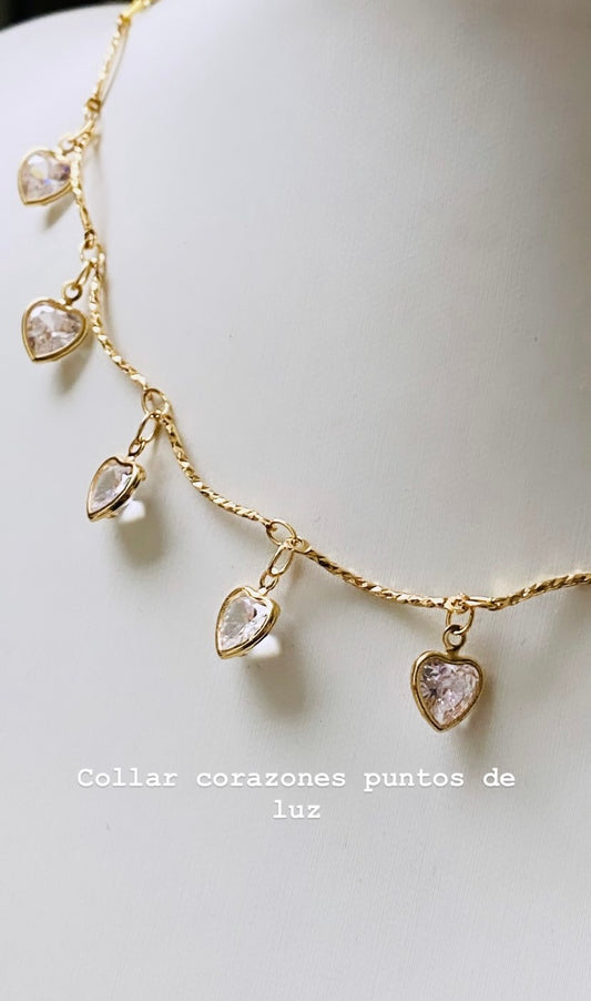 Corazones puntos de luz gold